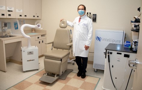 Erik Cohen, MD, shows additional safety tools in place in a treatment room.