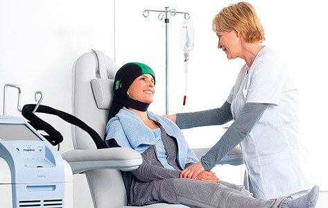 Patient receives scalp cooling during chemotherapy
