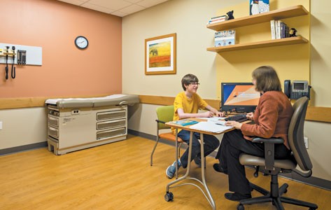 Young boy speaking to a behavioral medicine counselor
