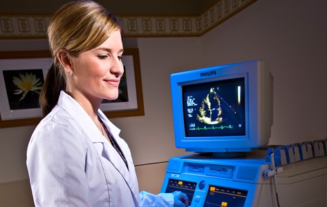 Cardiac imaging professional performing echocardiogram