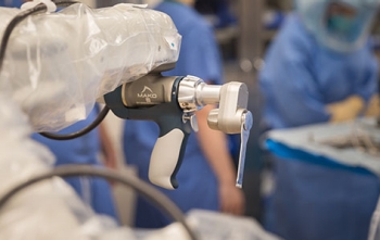 Surgeon using Mako™ Robotic-Arm Assisted Surgery System