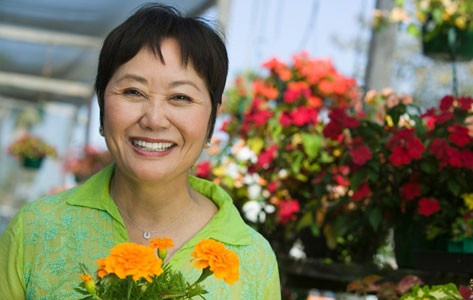 Asian woman holding flowers