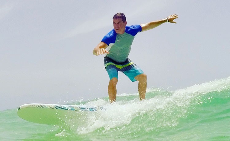 Mark B. is back to surfing after brain tumor surgery.