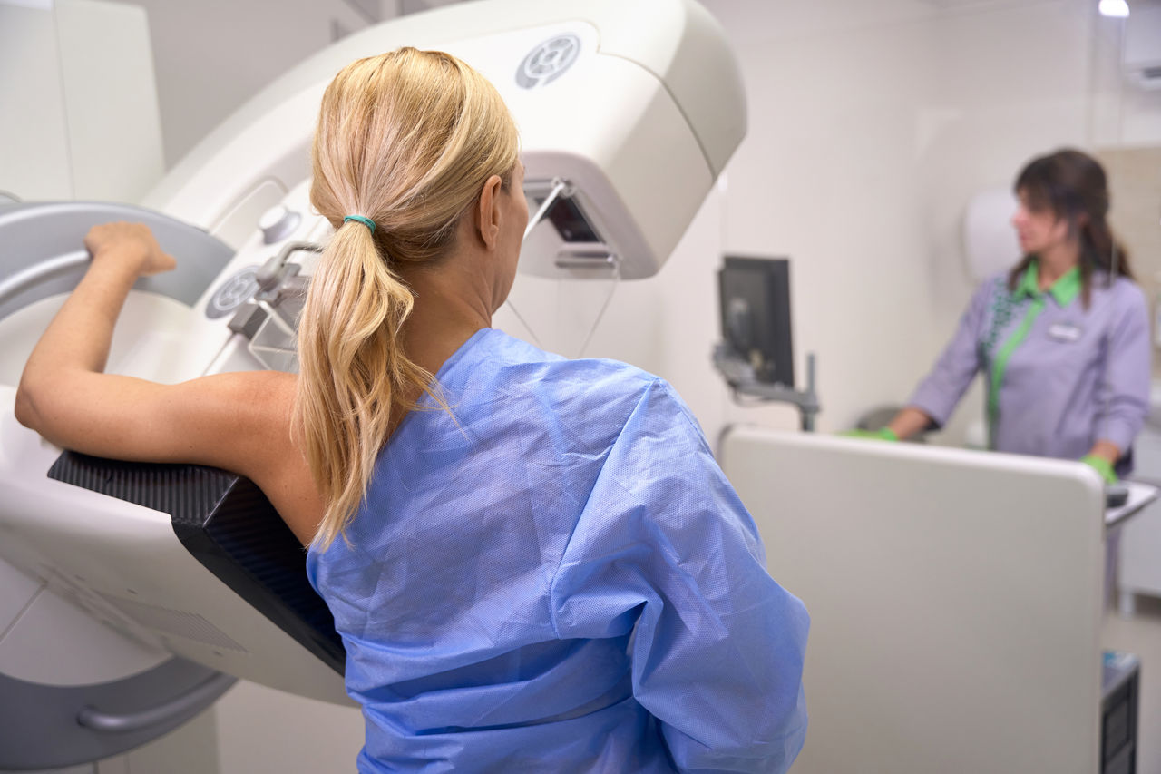 A woman gets a mammogram.