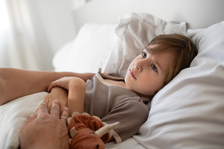 Little boy ill at home with a virus or infectious disease