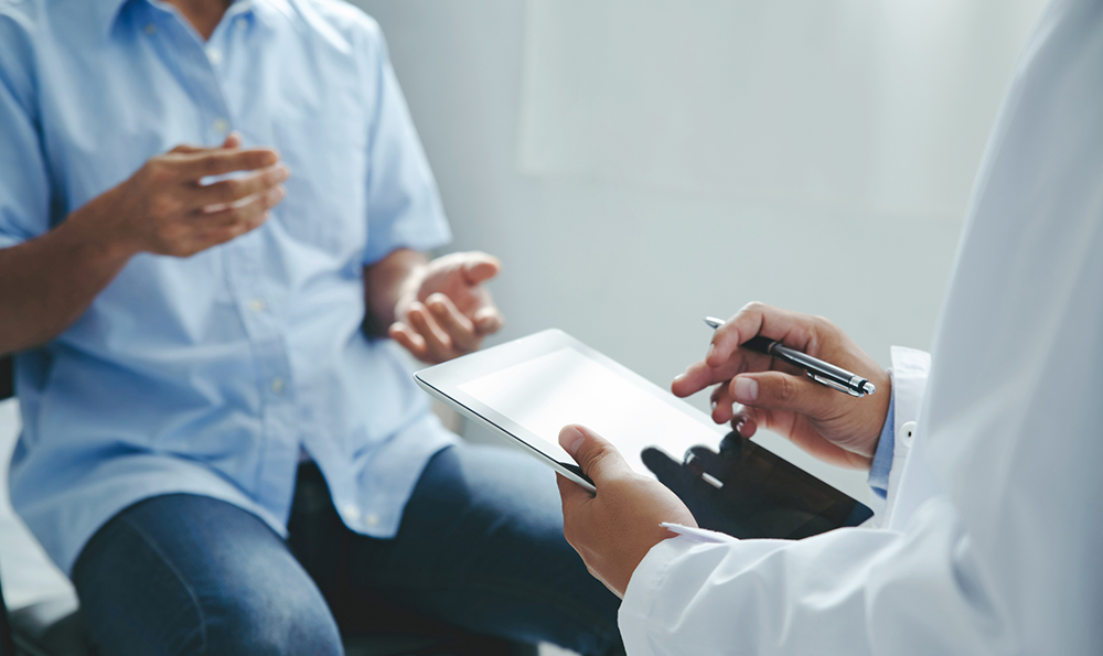 Male patient talks to his doctor.