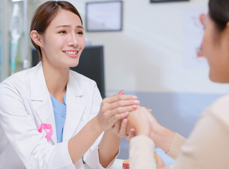 Woman receives mammogram.