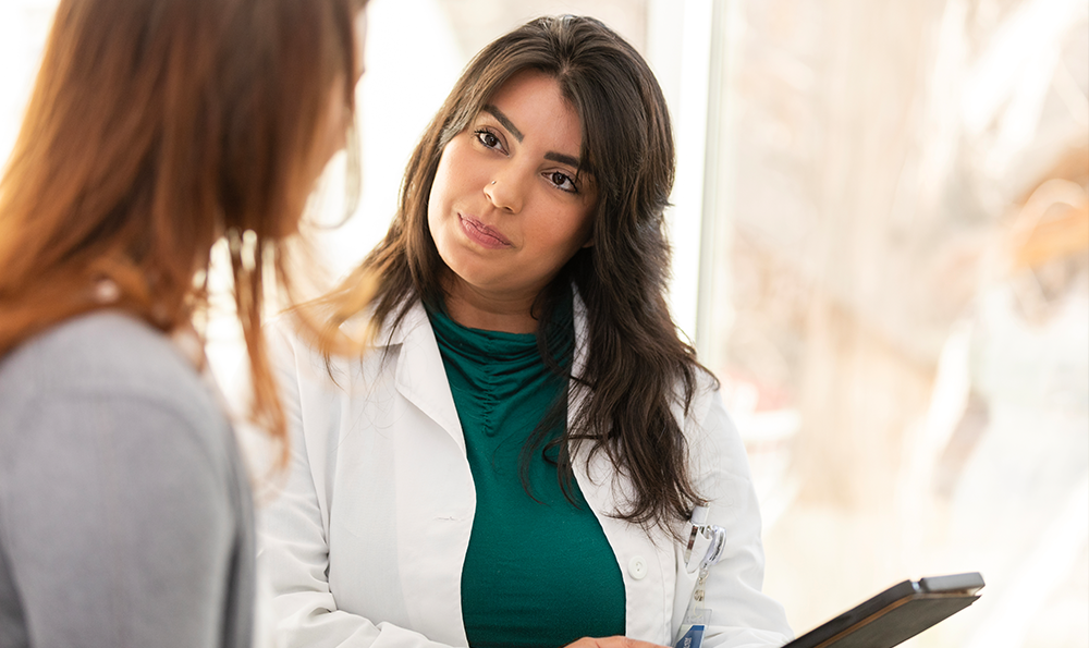 A woman discusses HRT with her doctor.