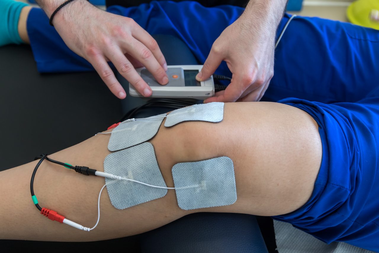 Electronic therapy on knee used to treat pain
